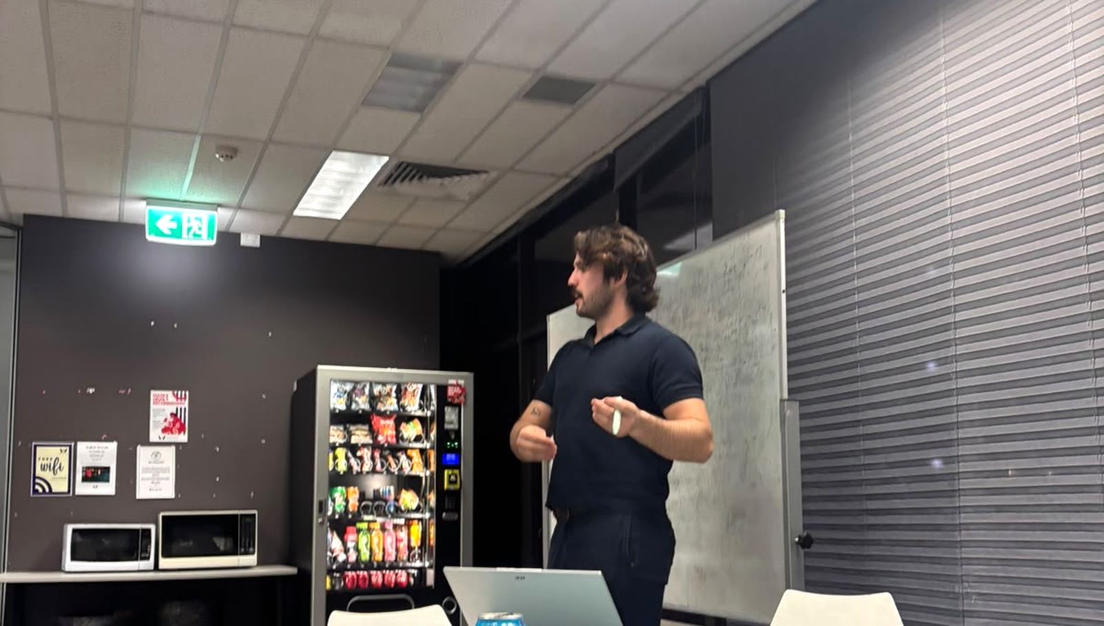 Jasper teaching a sales class at a whiteboard